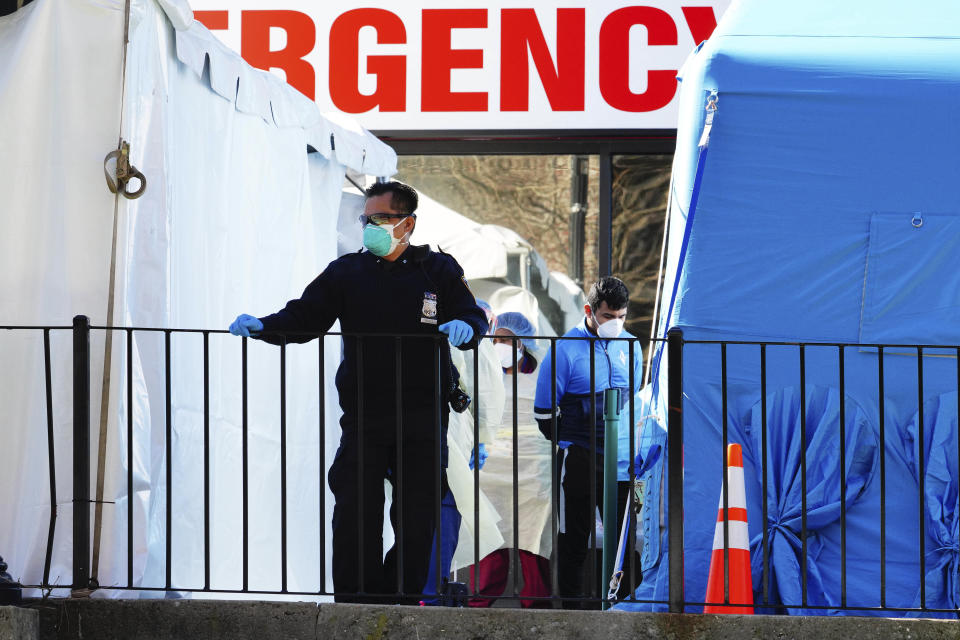 Photo by: John Nacion/STAR MAX/IPx 2020 3/27/20 Medical Workers and Police are seen at Elmhurst Hospital in Queens, New York while a large Thank You Sign is placed outside for all those health care professionals who have labored tirelessly while risking their own lives to help others.