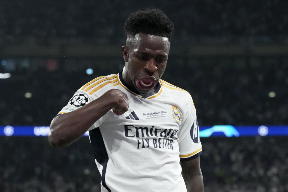 Real Madrid's Vinicius Junior celebrates after scoring his side's second goal during the Champions League final soccer match between Borussia Dortmund and Real Madrid at Wembley stadium in London, Sunday, June 2, 2024. (AP Photo/Frank Augstein)