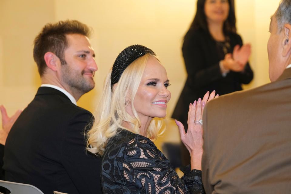 Kristin Chenoweth receives the Oklahoma Cultural Ambassador award Tuesday at the Governor's Arts Awards for Excellence in the Arts at the Capitol. Seated with Chenoweth are her fiance, Josh Bryant, left, and Owen Sapulpa, the husband of U.S. Poet Laureate Joy Harjo.