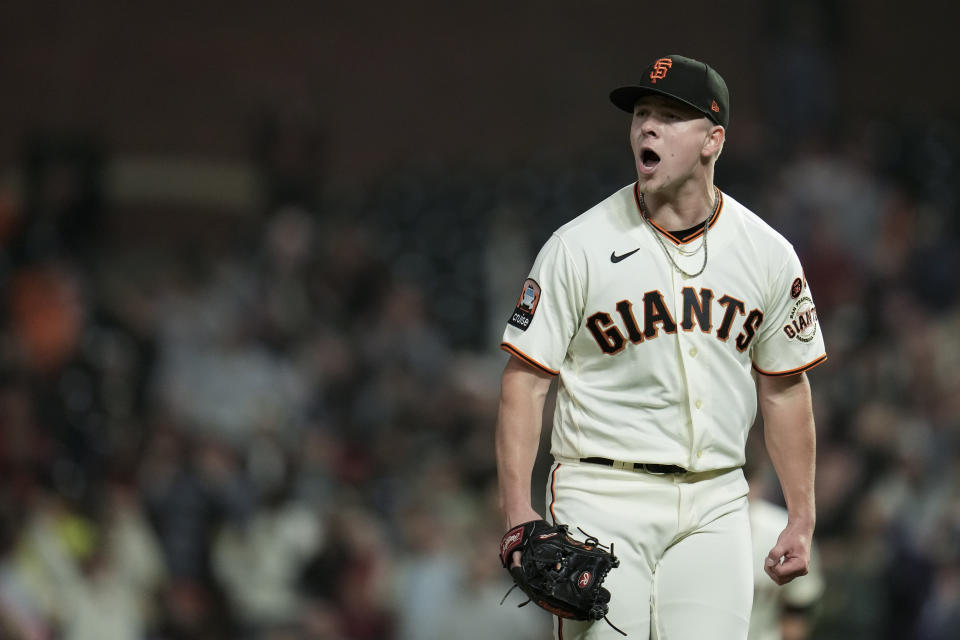 San Francisco Giants pitcher Kyle Harrison reacts after his 10th strikeout against the Cincinnati Reds during the fifth inning of a baseball game, Monday, Aug. 28, 2023, in San Francisco. (AP Photo/Godofredo A. Vásquez)