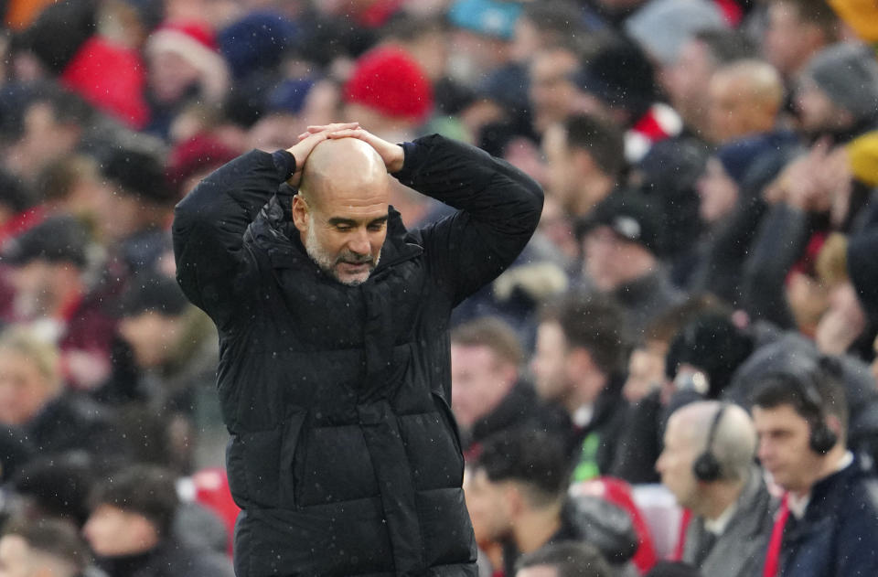 Manchester City's head coach Pep Guardiola reacts during the English Premier League soccer match between Liverpool and Manchester City, at Anfield stadium in Liverpool, England, Sunday, March 10, 2024. (AP Photo/Jon Super)