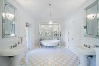 <p>The master bath boasts a gorgeous cast iron pedestal sunken tub. The home has a total of four full bathrooms and one powder room.</p>