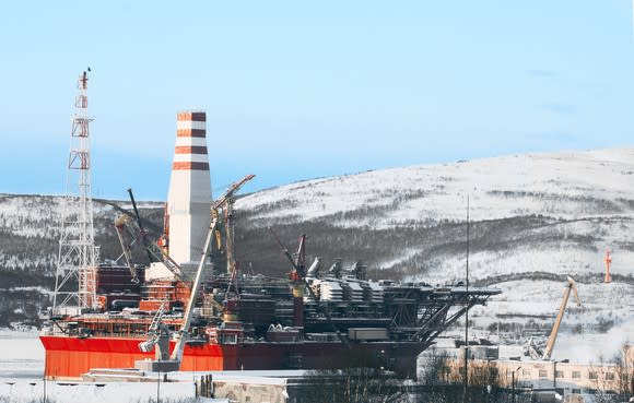 Winterized offshore oil platform at dock.