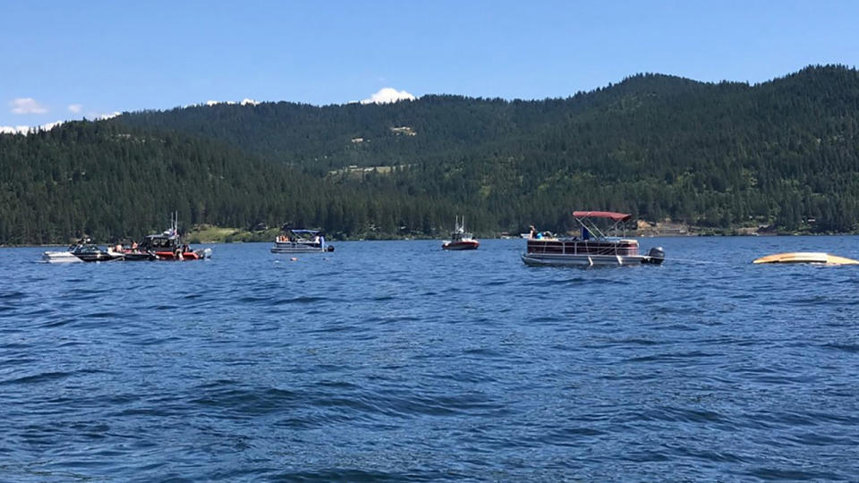 Boaters, pictured here flagging down authorities to the crashed planes on Lake Coeur d'Alene.