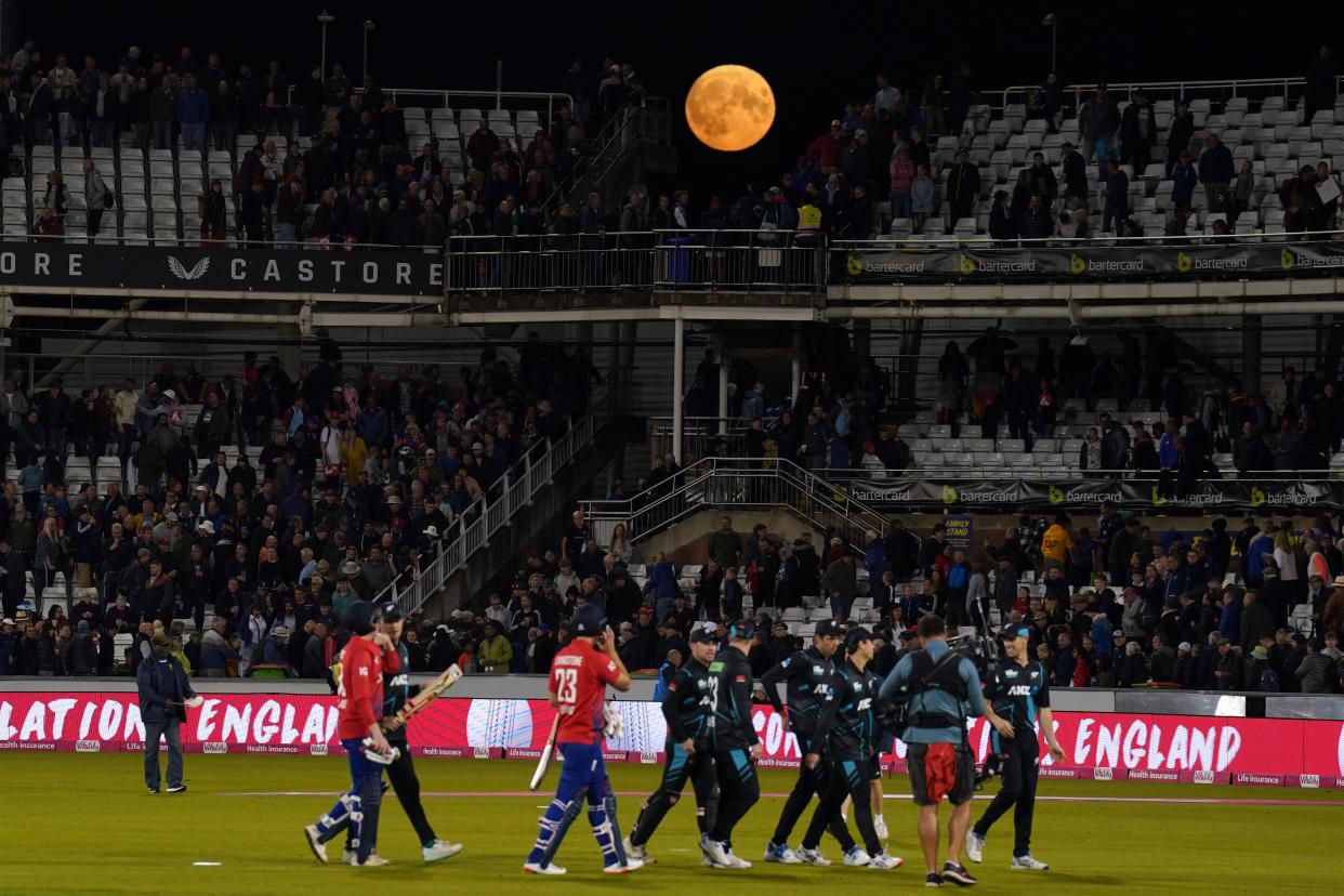 The Super Blue Moon is visible over the stands as the teams walk off after the first Vitality IT20 match at the Seat Unique Riverside, County Durham. Picture date: Wednesday August 30, 2023.