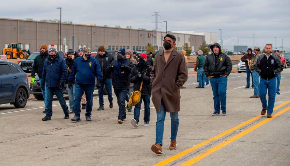 Union workers gather at a rally at the Amazon warehouse in Edwardsville, where six people died in a tornado on Dec. 10.