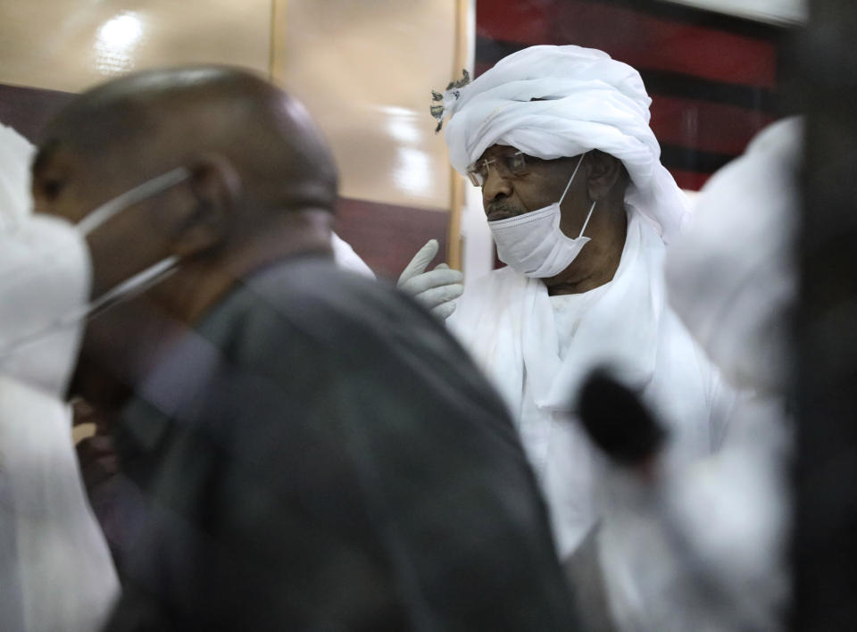 Former Sudanese vice president Bakri Hassan Saleh is behind bars during the trial of ousted Sudanese president Omar al-Bashir and over two dozen top officials in his government, in Khartoum, Sudan, Tuesday, July 21, 2020. The 76-year-old al-Bashir has been jailed in Khartoum since his ouster, facing several separate trials related to his rule and the uprising that helped oust him. Al-Bashir is also wanted by the International Criminal Court on charges of war crimes and genocide linked to the Darfur conflict in the 2000s. (AP Photo/Marwan Ali)