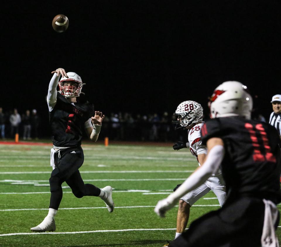 Westwood's QB Robbie Carcich throws a pass during the first half of the NJSIAA Group 2 State Semifinals at Westwood High School on November 17, 2023.