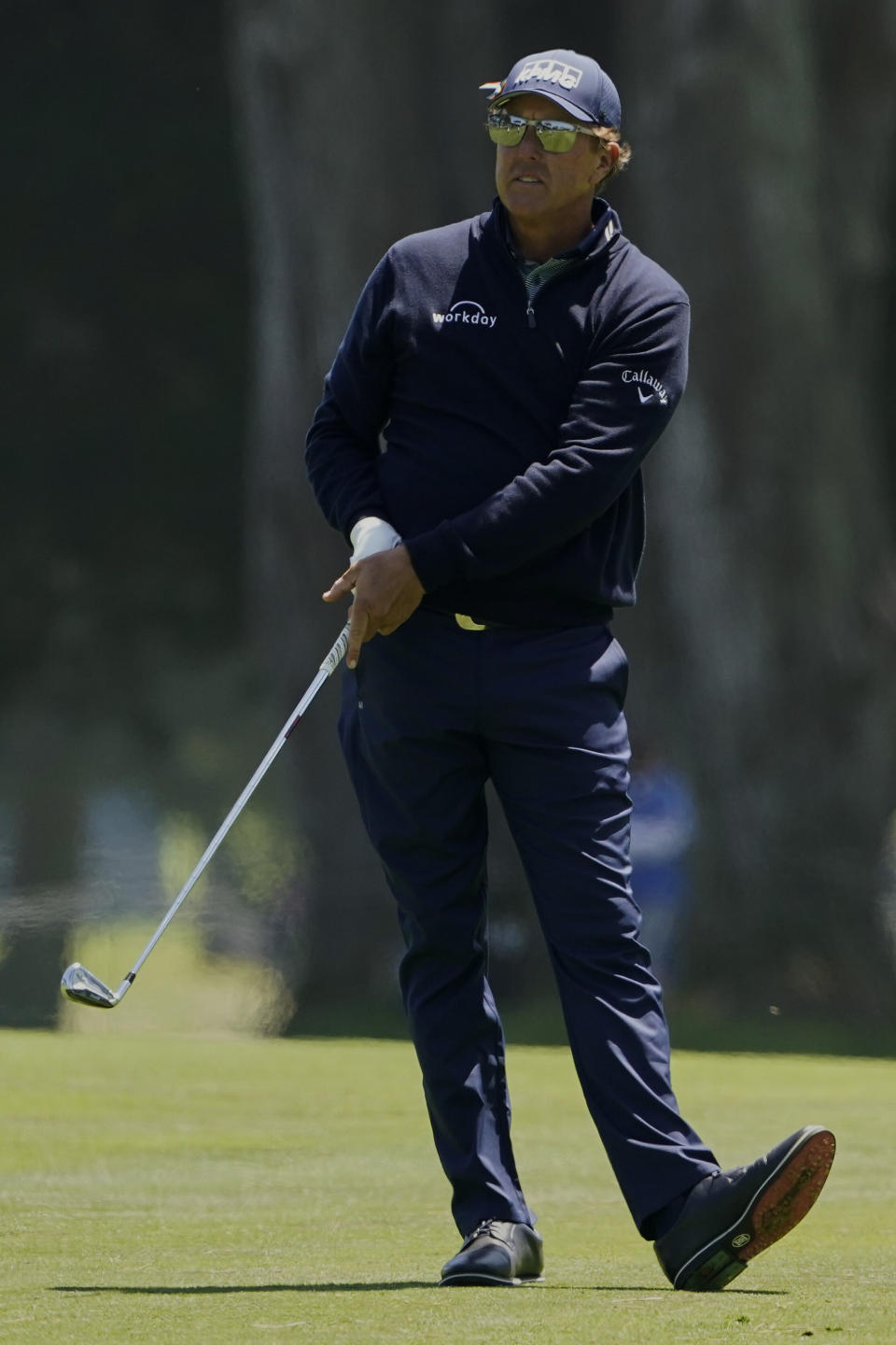 Phil Mickelson hits from the fairway on the ninth hole during the second round of the PGA Championship golf tournament at TPC Harding Park Friday, Aug. 7, 2020, in San Francisco. (AP Photo/Charlie Riedel)