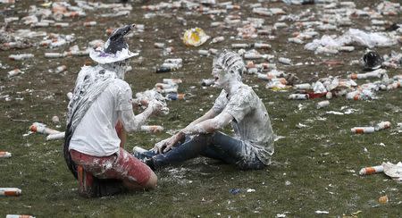 Students from St Andrews University are covered in foam as they take part in the traditional 'Raisin Weekend' in the Lower College Lawn, at St Andrews in Scotland, Britain October 17, 2016. REUTERS/Russell Cheyne