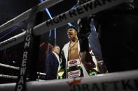Jaime Munguia motions from the ring before fighting Canelo Alvarez in a super middleweight title fight Saturday, May 4, 2024, in Las Vegas. (AP Photo/John Locher)