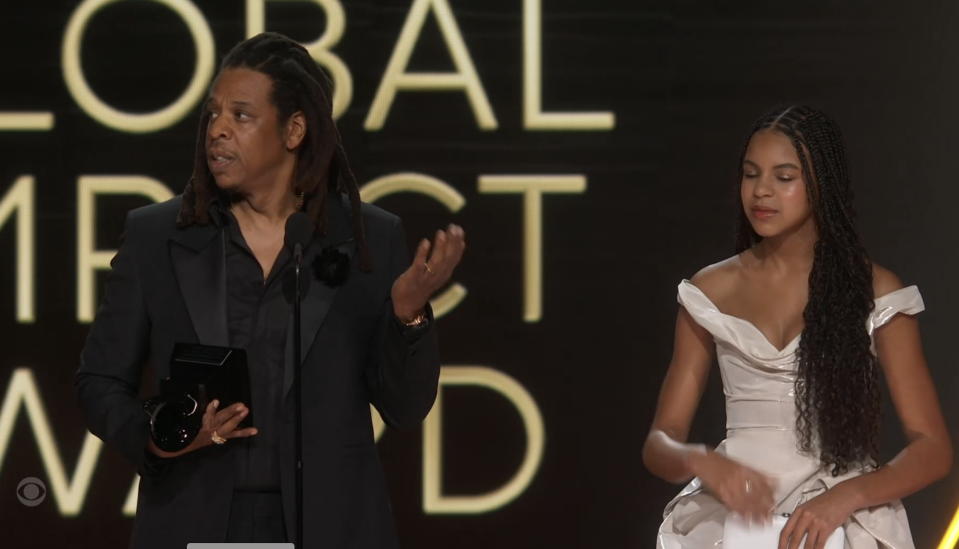 Jay-Z onstage with his daughter Blue Ivy