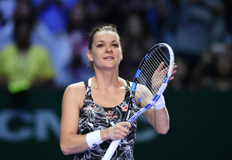 Agnieszka Radwanska celebrates beating Karolina Pliskova in the WTA finals on October 28, 2016 in Singapore, taking the Polish player into the semi-finals