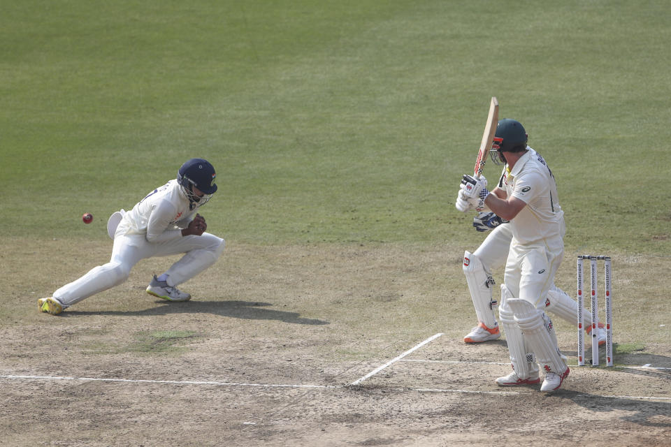 India's Shreyas Iyer, left, reacts to try and catch out Australia's Travis Head, right, during the third day of third cricket test match between India and Australia in Indore, India, Friday, March 3, 2023. (AP Photo/Surjeet Yadav)