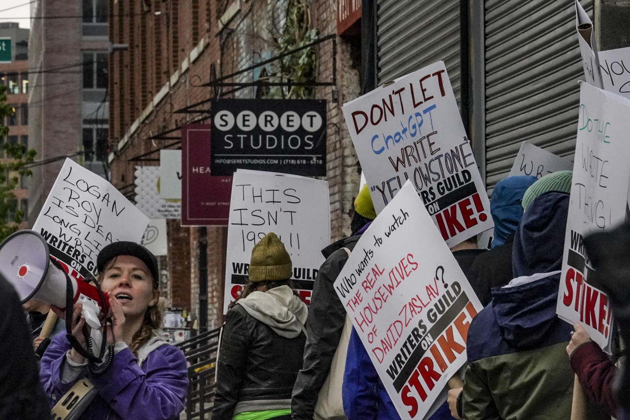 Striking writers and supporters call for better wages as they picket outside Brooklyn's Seret Studios--a production stage for television and films from studios, including Showtime, Netflix and Marvel, Thursday, May 4, 2023, in New York. (AP Photo/Bebeto Matthews)