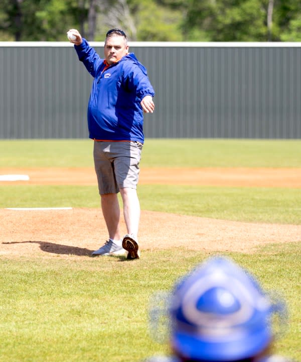 Steve Rayburn throwing out the ceremonial first pitch on Saturday, March 23.