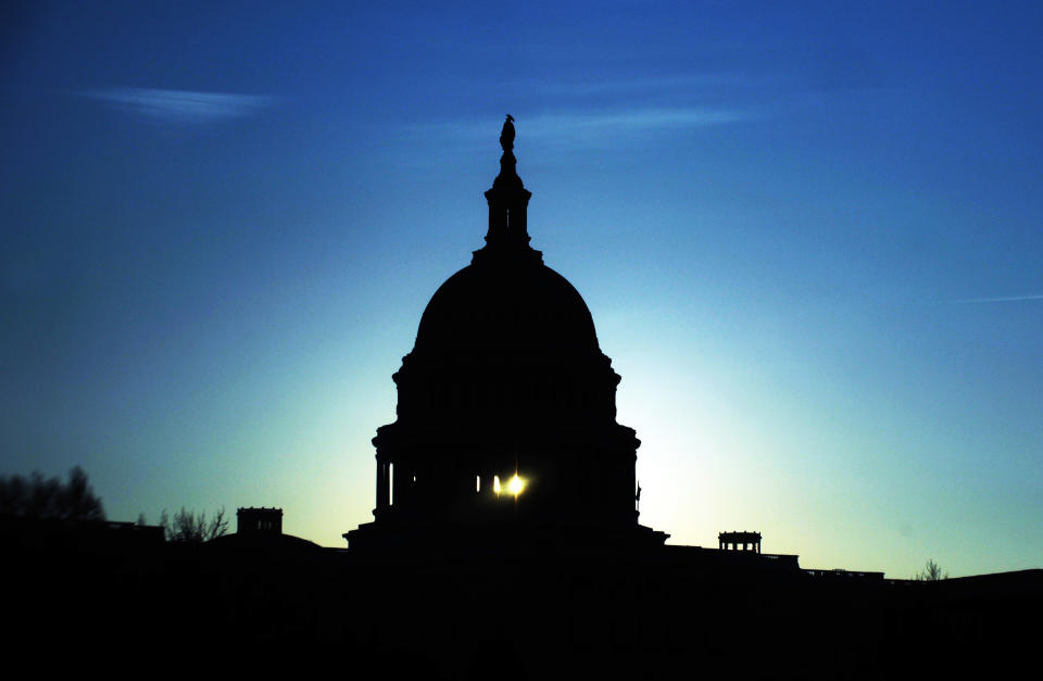 The Capitol dome is seen silhouetted against the rising sun in Washington, DC, on February 1, 2010. (JEWEL SAMAD/AFP/Getty Images)