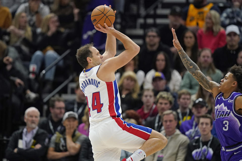 Detroit Pistons forward Bojan Bogdanovic (44) shoots as Utah Jazz guard Keyonte George (3) defends during the first half of an NBA basketball game Wednesday, Jan. 3, 2024, in Salt Lake City. (AP Photo/Rick Bowmer)