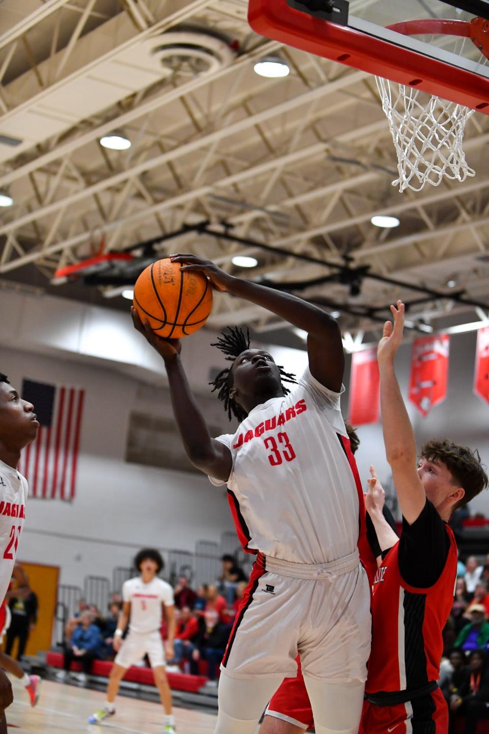 Port St. Lucie’s Daniel Alexis (33) takes a shot in a boys high school basketball district 13-5A quarterfinal, Thursday, Feb. 8, 2024, in Port St. Lucie.