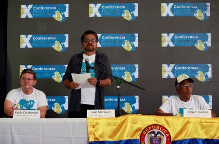 Revolutionary Armed Forces of Colombia (FARC) commander Ivan Marquez speaks between Pablo Catatumbo and Joaquin Gomez during a news conference at the camp where they prepare to ratify a peace deal with the Colombian government, near El Diamante in Yari Plains, Colombia, September 23, 2016. REUTERS/John Vizcaino