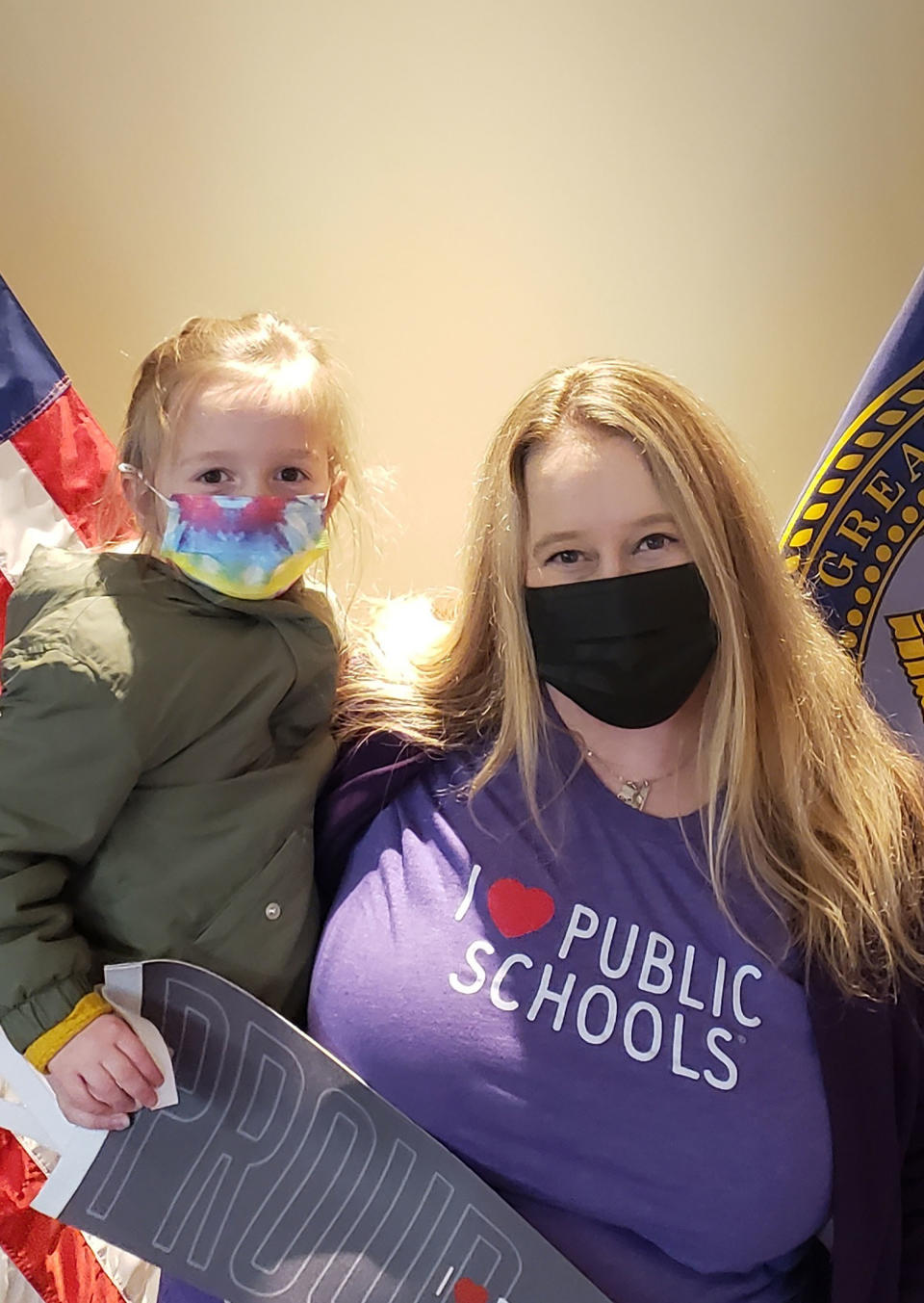Lisa Schoenberger holds her 5-year-old daughter, Clara, as she files to run for school board.<span class="copyright">Courtesy Lisa Schoenberger</span>