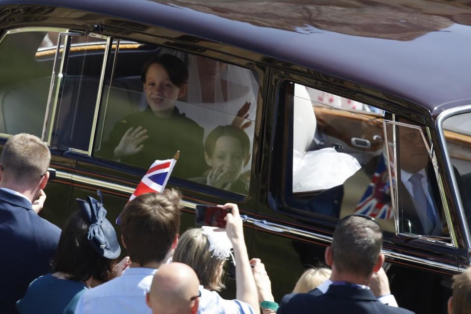 Twins Brian and John Mulroney looked thrilled as they waved at crowds (Getty Images)