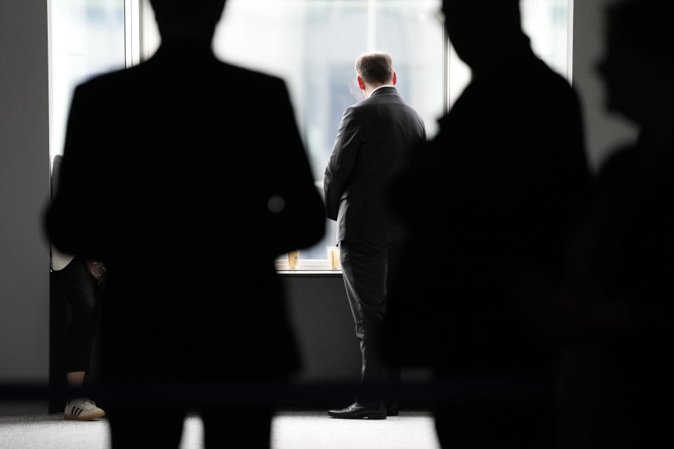 Security officers gather in a corridor after searching the office of German MEP Maximilian Krah at the European Parliament in Brussels, Tuesday May, 7, 2024. Germany's top prosecutor's office says that authorities are searching the European parliament office of Maximilian Krah, the Alternative for Germany party's top candidate in the upcoming European Parliament elections. Krah, has been under scrutiny after an assistant of his was arrested last month on suspicion of spying for China. (AP Photo/Virginia Mayo)