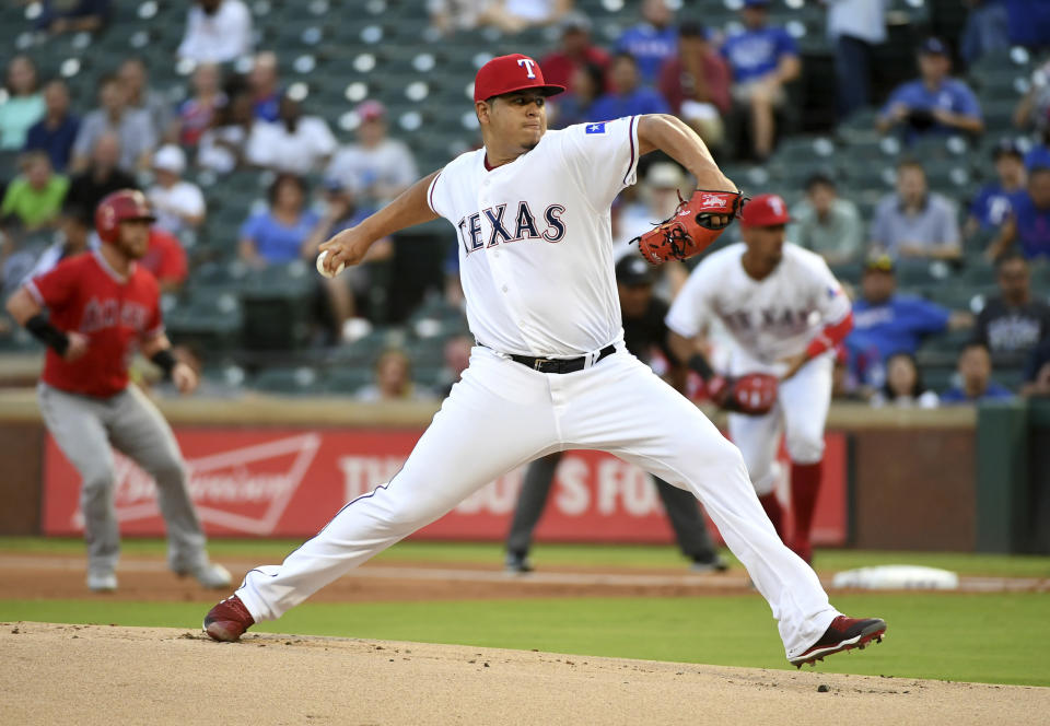 Texas Rangers starting pitcher Ariel Jurado works against the Los Angeles Angels during the first inning of a baseball game, Thursday, Aug. 16, 2018, in Arlington, Texas. (AP Photo/Jeffrey McWhorter)