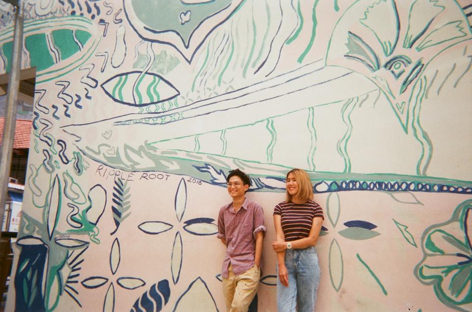 Ripple Root posing in front of their mural. (PHOTO: Ripple Root)