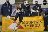 BYU linebacker Isaiah Kaufusi (53) carries the ball after an interception against Texas State in the second half during an NCAA college football game Saturday, Oct. 24, 2020, in Provo, Utah. (AP Photo/Rick Bowmer)