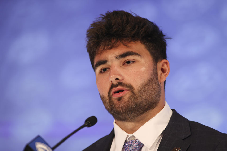 North Carolina quarterback Sam Howell answers a question during the NCAA college football Atlantic Coast Conference media days in Charlotte, N.C., Wednesday, July 21, 2021. (AP Photo/Nell Redmond)