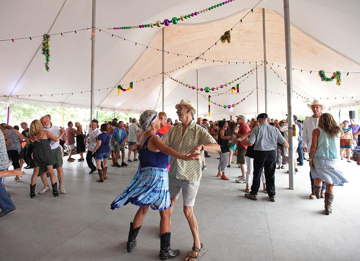 Fans dance to the music under the tent at the 2016 Rhythm & Roots Festival. After a cancellation earlier this year, the festival is back on for Labor Day weekend at Ninigret Park in Charlestown.
