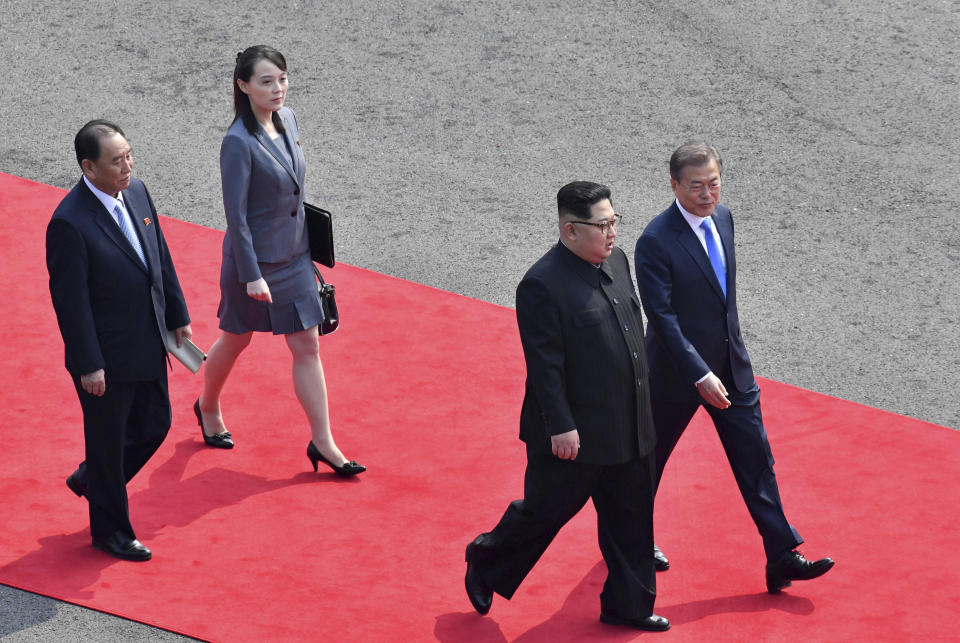 FILE - In this April 27, 2018, file photo, North Korean leader Kim Jong Un, second from right, walks with South Korean President Moon Jae-in, right, to hold their meeting at the border village of Panmunjom in Demilitarized Zone. Second from left is Kim's sister Kim Yo Jong. Kim Jong Un's disappearance from the public eye is raising speculation about not only his health but also about who's next in line to run North Korea if anything happens to the leader. Some experts say his sister and close associate Kim Yo Jong is most likely since North Korea has been ruled by the Kim family for seven decades. (Korea Summit Press Pool via AP, File)