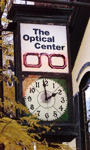 The Optical Center sign and clock at 107 Church Street in Burlington are seen in this undated file photo. The clock was built in the early 1900s and installed shortly thereafter.