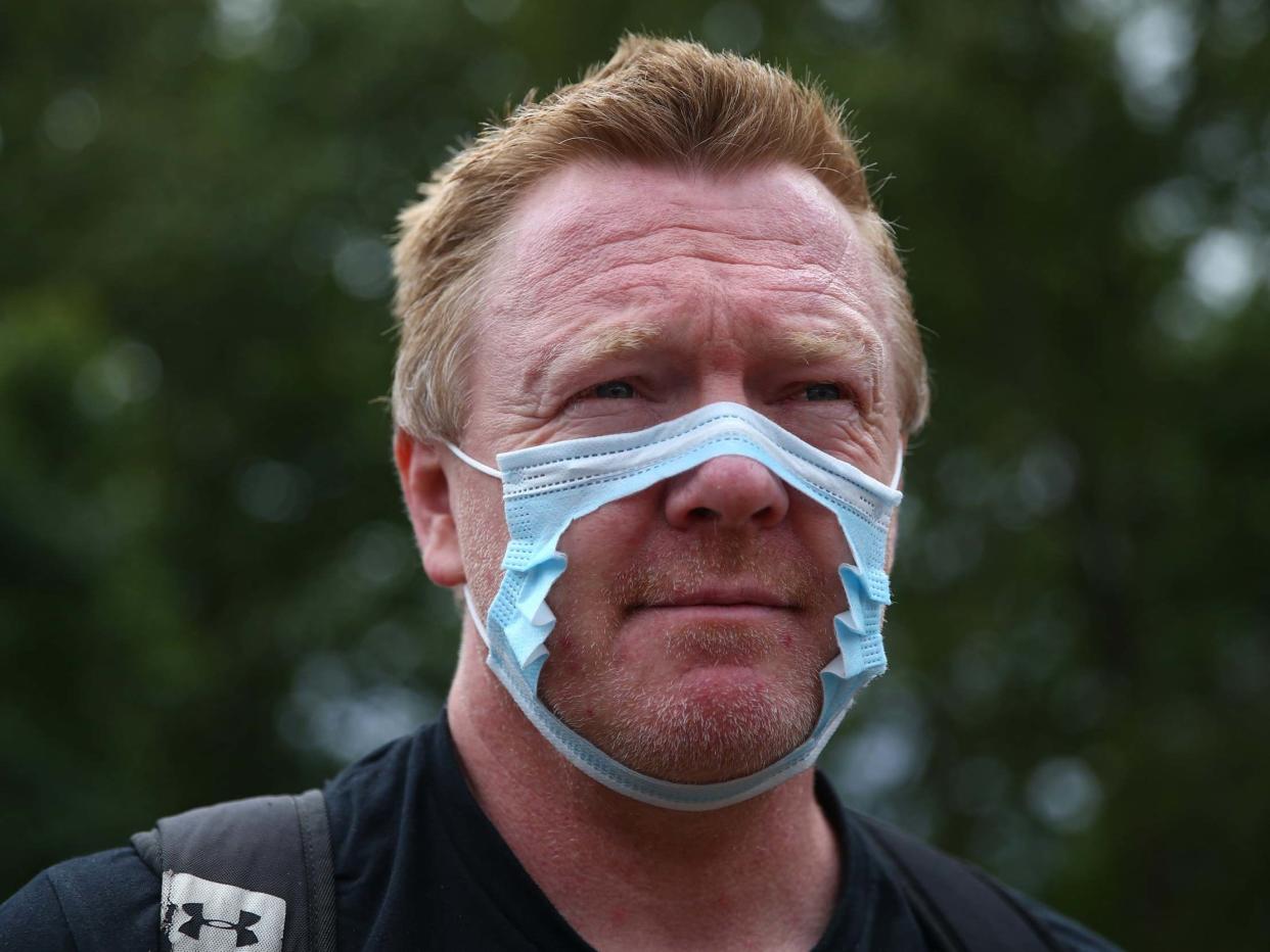 A man wearing a cut-out mask attends the Keep Britain Free movement anti-mask protest on July 19, 2020 in London: Getty Images