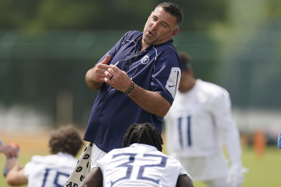 Tennessee Titans head coach Mike Vrabel talks with running back Tyjae Spears (32) during practice at the NFL football team's training facility Thursday, June 8, 2023, in Nashville, Tenn. (AP Photo/George Walker IV)