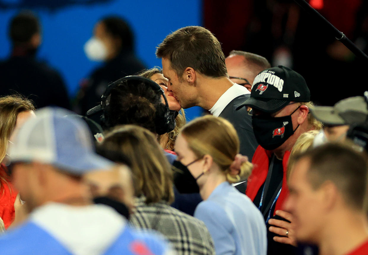 TAMPA, FLORIDA - FEBRUARY 07: Tom Brady #12 of the Tampa Bay Buccaneers celebrates with Gisele Bundchen after winning Super Bowl LV at Raymond James Stadium on February 07, 2021 in Tampa, Florida. (Photo by Mike Ehrmann/Getty Images)