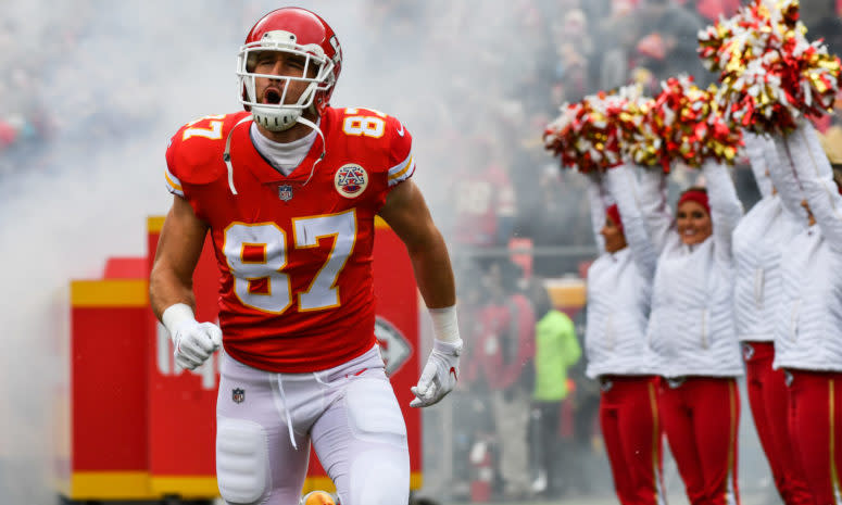 Kansas City Chiefs star Travis Kelce runs onto the field.