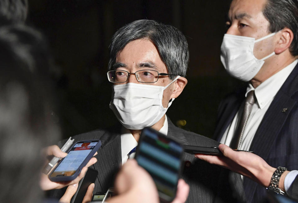 Minoru Terada, then internal affairs minister, is surrounded by reporters at the prime minister's official residence in Tokyo, Japan, Sunday, Nov 20, 2022. Terada was forced into resigning over funding problems on Sunday, in a blow to the scandal-prone Cabinet that has already lost two ministers in one month. (Kyodo News via AP)