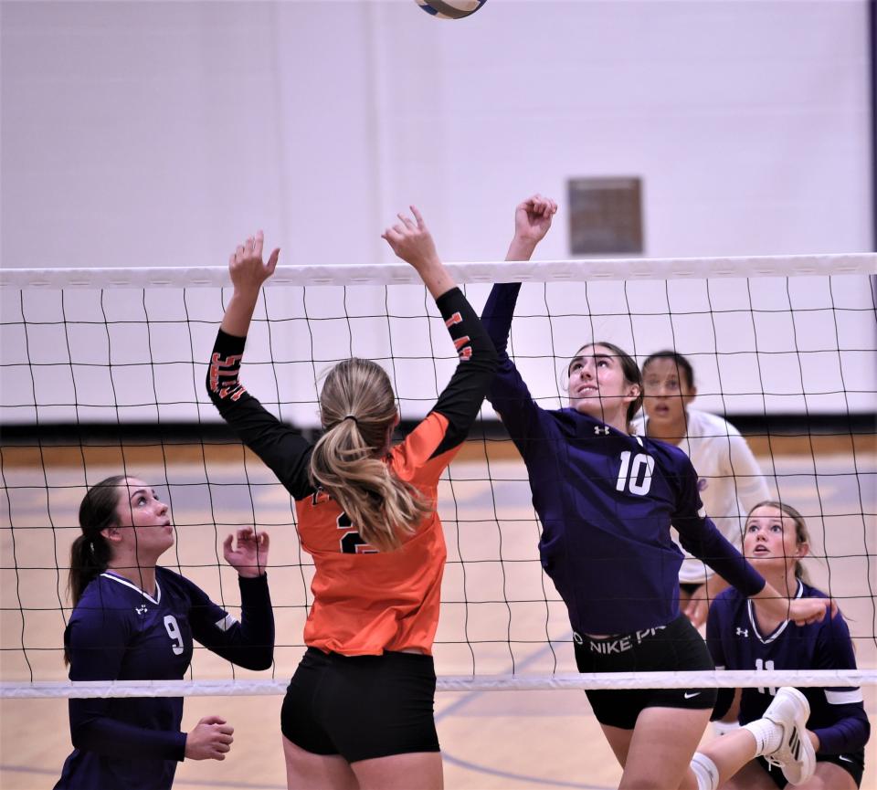 Wylie's Mallory Bankhead (10) battles Llano's Madi Green (2) for the ball at the net. Wylie beat Llano 25-11, 25-11 in pool play at the Bev Ball Classic on Friday at Bulldog Gym.
