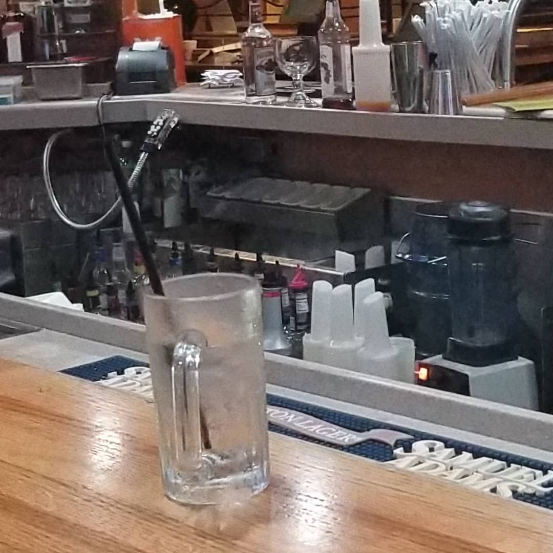 An opossum ran into a Columbia, South Carolina Applebee's hiding behind the bar. (Facebook/Adriane Neico)