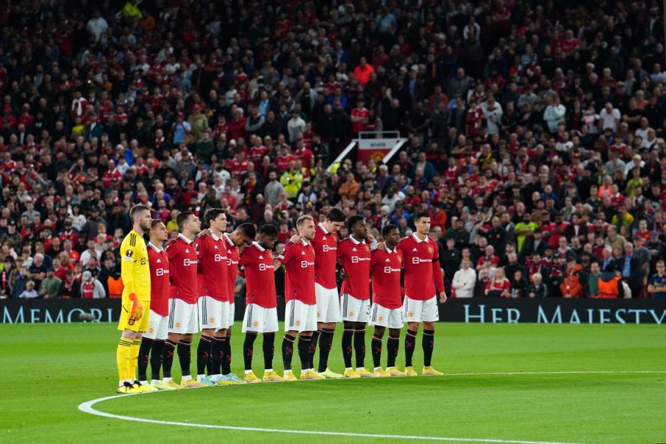 Manchester United take part in a minute’s silence at Old Trafford on Thursday (PA Wire)