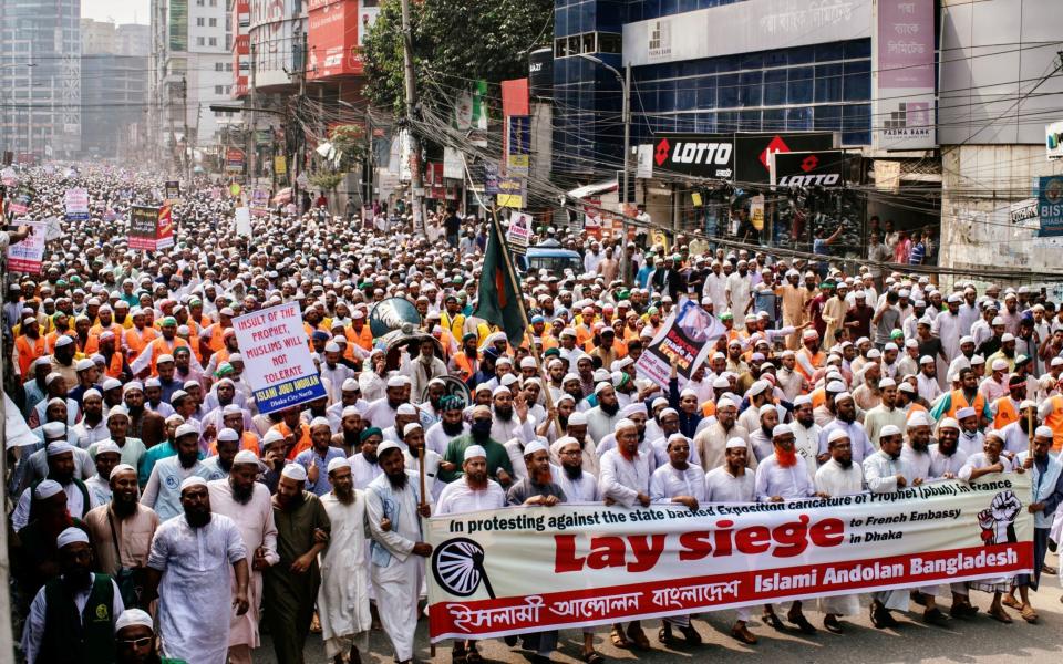 Supporters and activists of the Islami Andolan Bangladesh group march in Dhaka -  REUTERS