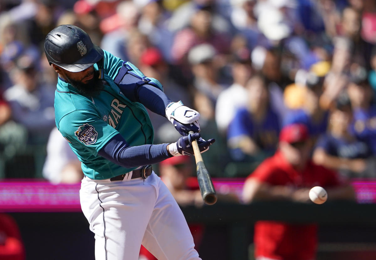 Los Angeles Angels' Brett Phillips (4) celebrates his solo home run with  Kyren Paris, right, against the Seattle Mariners during the third inning of  a baseball game, Wednesday, Sept. 13, 2023, in