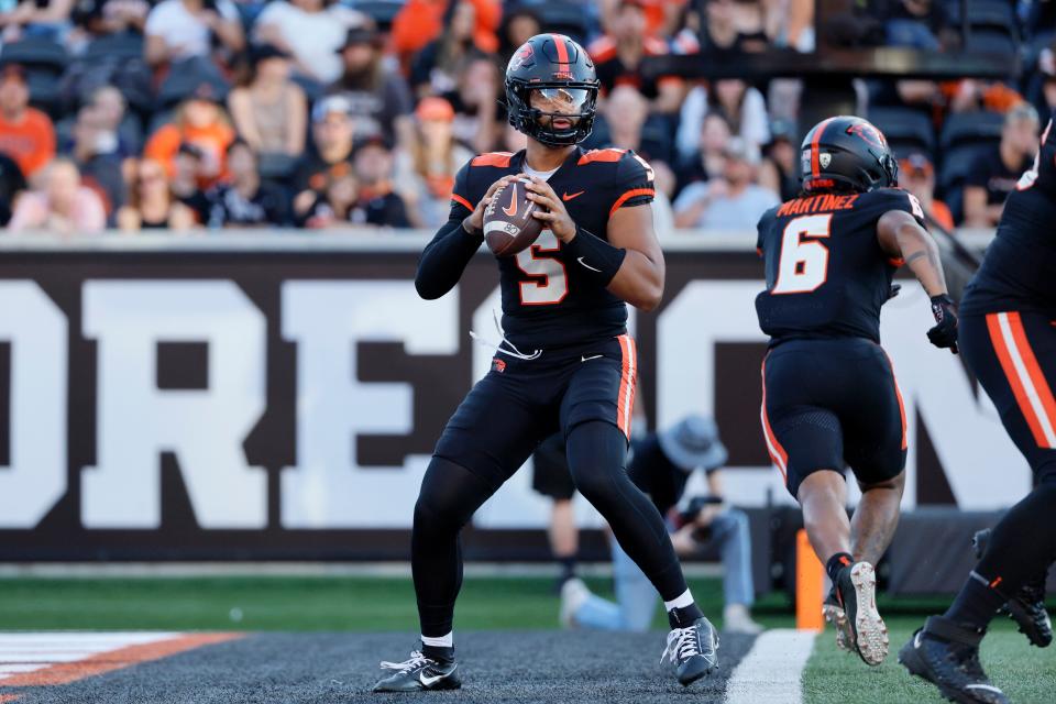 Oregon State Beavers quarterback DJ Uiagalelei (5) looks to throw during the first half against the UC Davis Aggies at Reser Stadium.