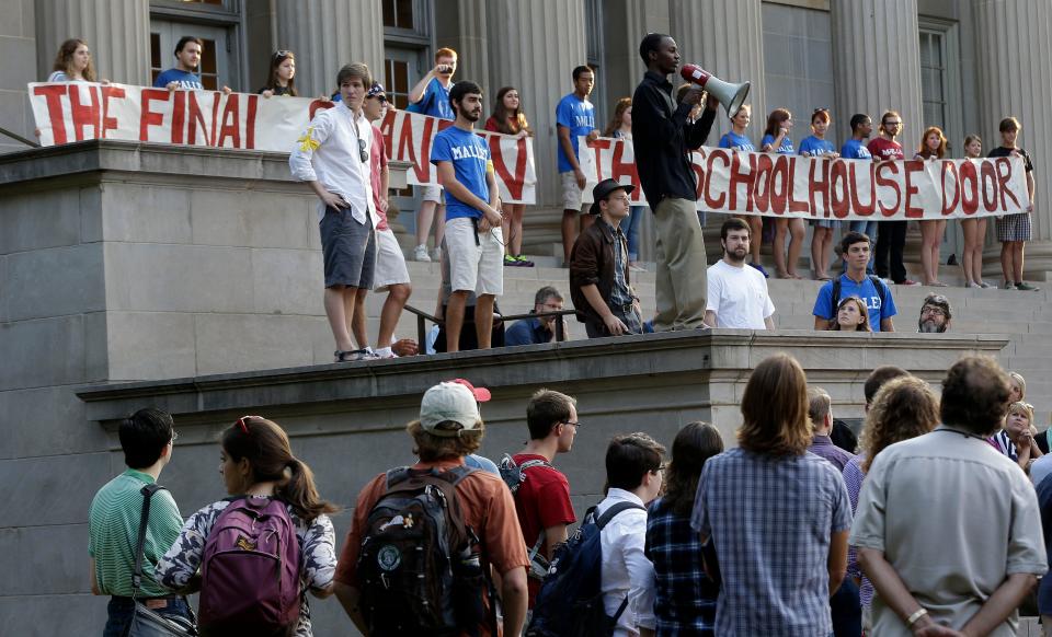 Univ. of Alabama student Isaac Bell of Montgomery, Ala., speaks to other students who gathered for a march on the Rose Administration Building to protest the university's segregated sorority system on the campus in Tuscaloosa, Ala., Wednesday, Sept. 18, 2013. About 400 students and faculty marched across the campus to oppose racial segregation among its Greek-letter social organizations.