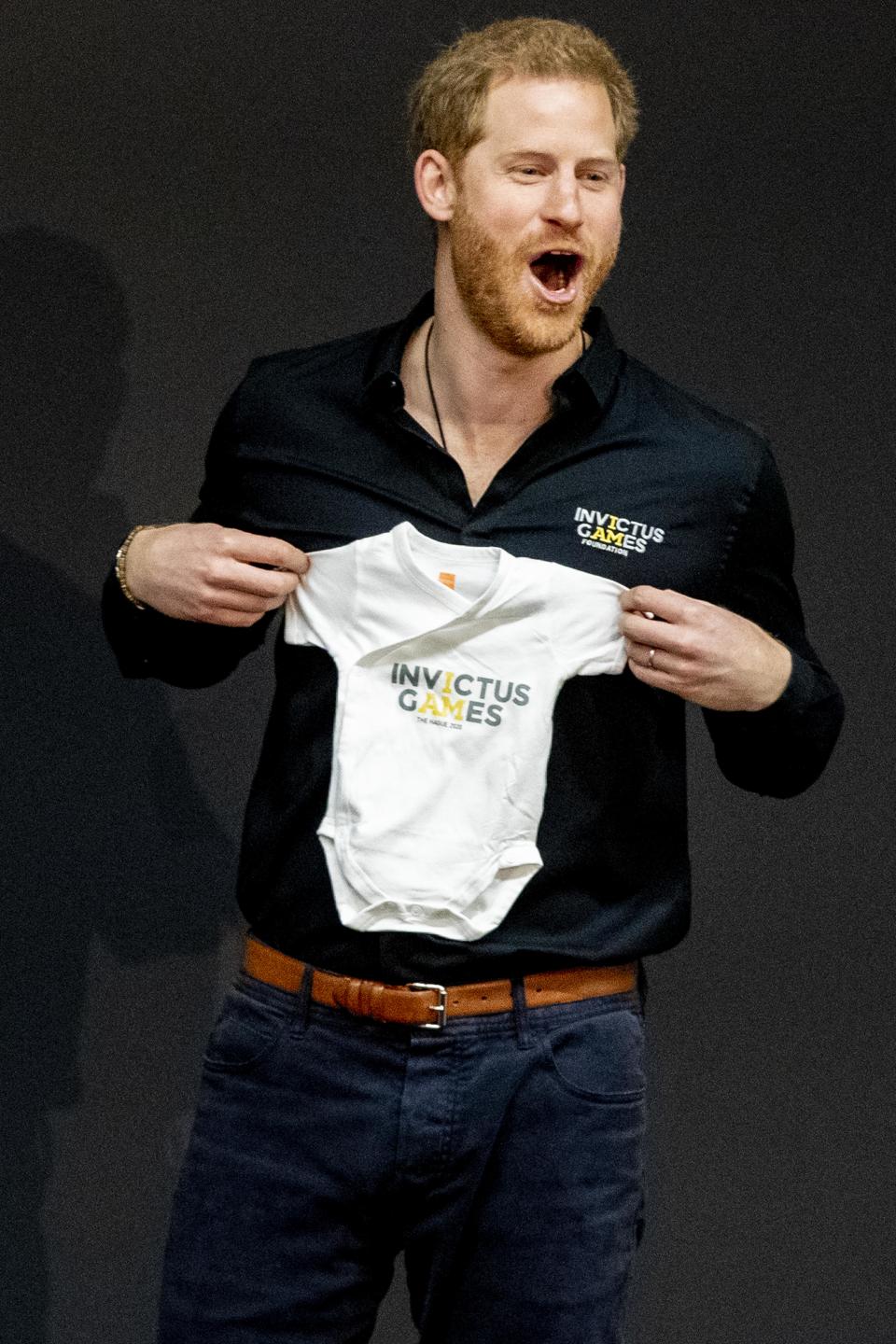 THE HAGUE, NETHERLANDS - MAY 09: Prince Harry, Duke of Sussex is presented with an Invictus Games baby grow for his newborn son Archie during the launch of the Invictus Games on May 9, 2019 in The Hague, Netherlands. (Photo by Patrick van Katwijk/WireImage)