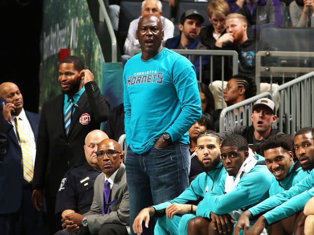 <p>Brock Williams-Smith/NBAE/Getty </p> Michael Jordan looks on during a game between the Indiana Pacers and the Charlotte Hornets in 2019