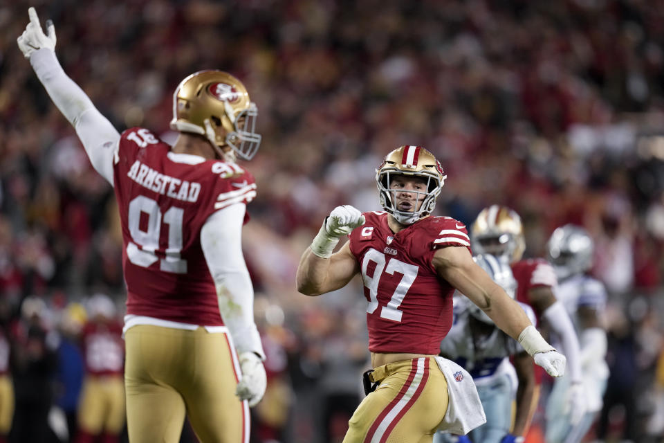 San Francisco 49ers defensive end Arik Armstead (91) and defensive end Nick Bosa (97) react after tackling Dallas Cowboys quarterback Dak Prescott during the second half of an NFL divisional playoff football game in Santa Clara, Calif., Sunday, Jan. 22, 2023. (AP Photo/Godofredo A. Vásquez)