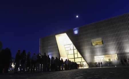 Visitors form a queue at the entrance to the Museum of the History of the Polish Jews, on the Night of the Museums in Warsaw in this May 18, 2013 file photo. REUTERS/Peter Andrews/Files